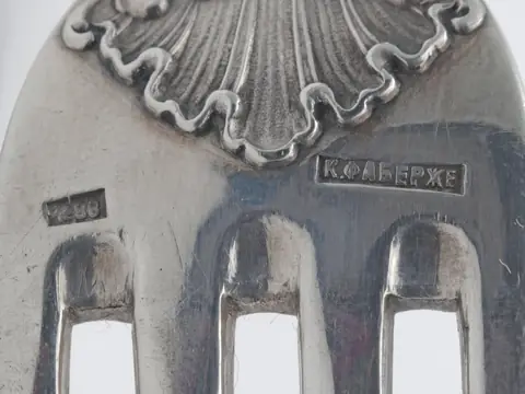 The back of a silver fork by Fabergé, struck with the maker's name in Cyrillic and the fineness mark 88